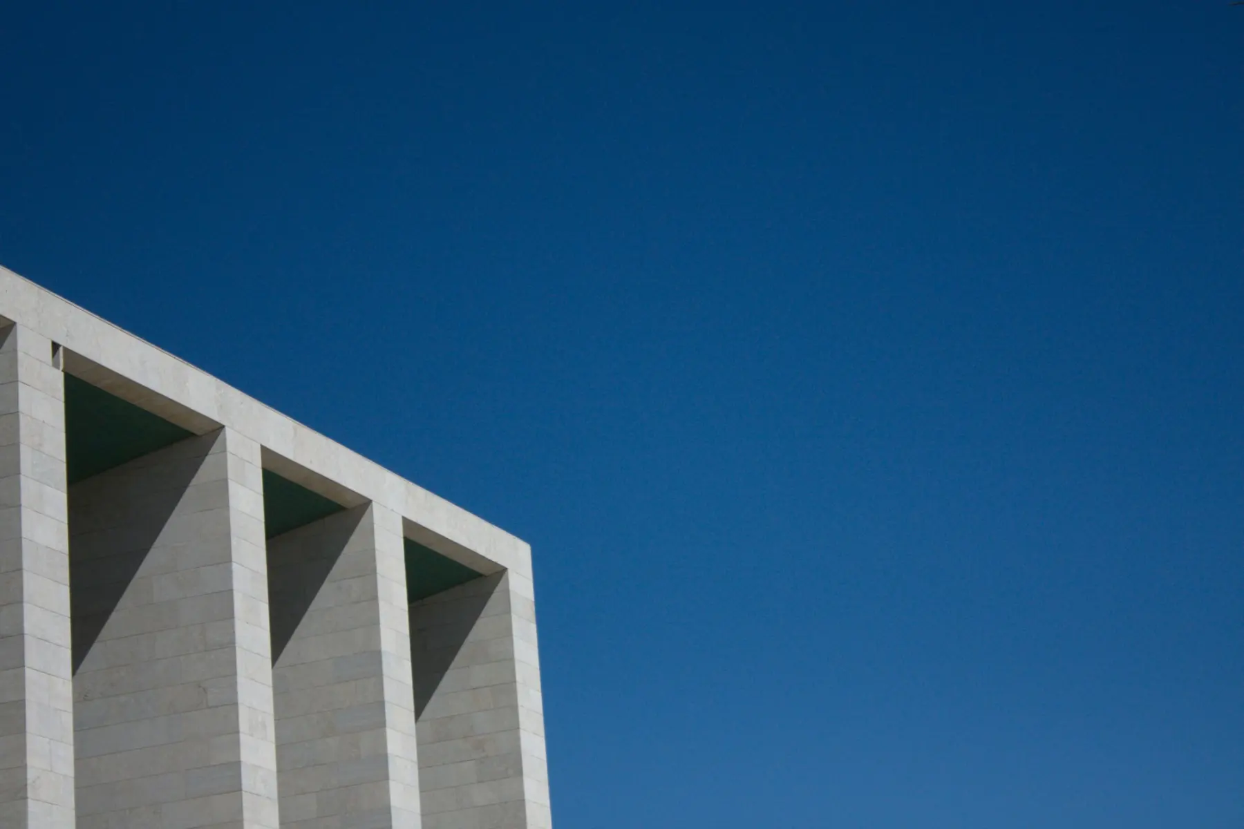 Bright building edge against a blue sky